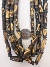 dark brown off white, triangle line motif, vintage stock bone, 25x8mm carved top and bottom tube, 15" strand, sold per strand