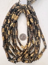 dark brown off white, triangle line motif, vintage stock bone, 25x8mm carved top and bottom tube, 15" strand, sold per strand