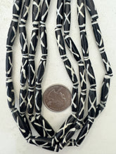 black off white, x line motif, vintage stock bone, 24x6mm bowed tube, 15" strand, sold per strand