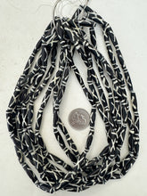 black off white, x line motif, vintage stock bone, 24x6mm bowed tube, 15" strand, sold per strand