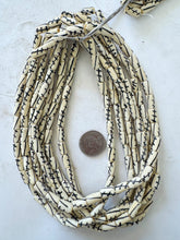 off white black, crossing lines motif, vintage stock bone, 12x5mm tube, 15" strand, sold per strand