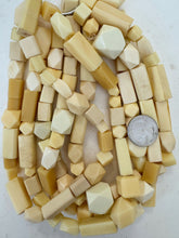 off white 4 sided  mix, faux bone, vintage look resin, 15" strand, sold per strand