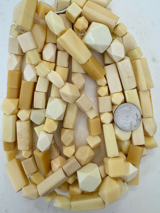 off white 4 sided  mix, faux bone, vintage look resin, 15