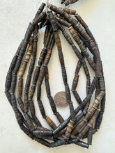 dark brown, carved lines motif, vintage stock bone, 26x8mm bowed tube, 15" strand, sold per strand