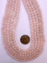 variable tone rose quartz, 6-7mm round, 15" strand,  SOLD PER STRAND