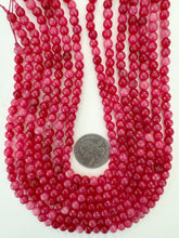 bright strawberry red enhanced quartz, 6mm faceted round, 15" strand, sold per strand