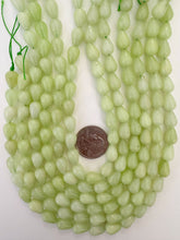 pale lime green color enhanced quartz, 12x8mm pear teardrop, 15" strand, sold per strand