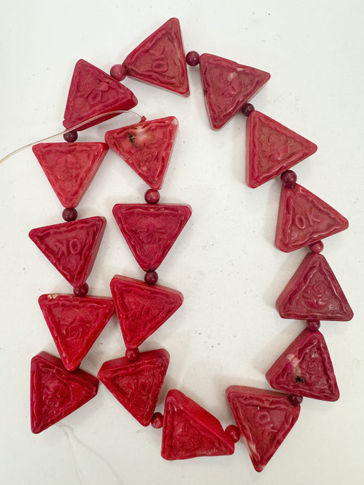 color enhanced ox blood coral, 23x21x8mm hand carved OK and floral motif triangle, 15