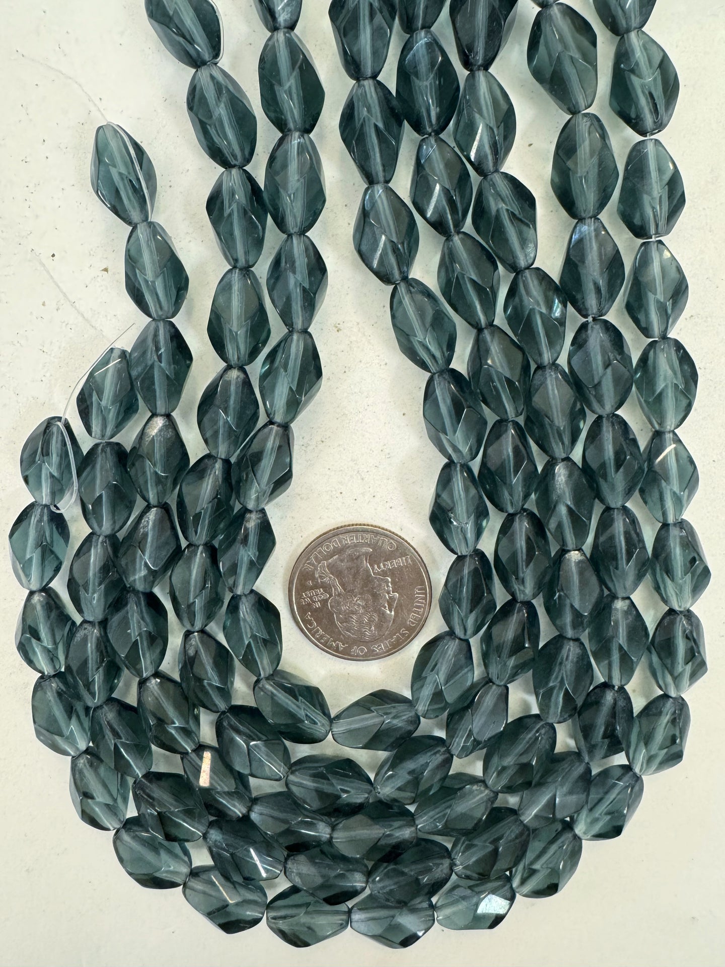 dark blue gray, single color, vintage look glass, 10x7mm fancy facet cut bowed tube, 14