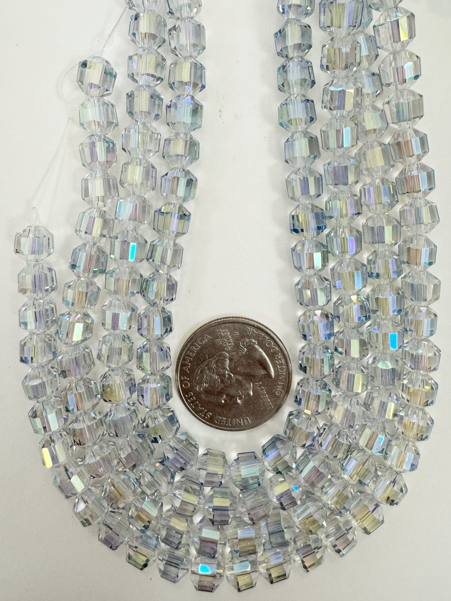 blue AB flash coated clear, fancy cut, vintage look glass, 7mm faceted bicone barrel, 9.5