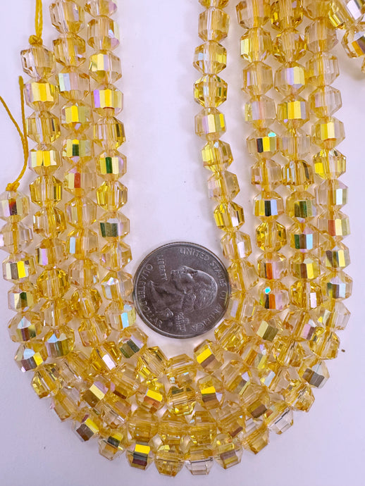 bright yellow AB flash coated clear, fancy cut, vintage look glass, 7mm faceted bicone barrel, 9.5