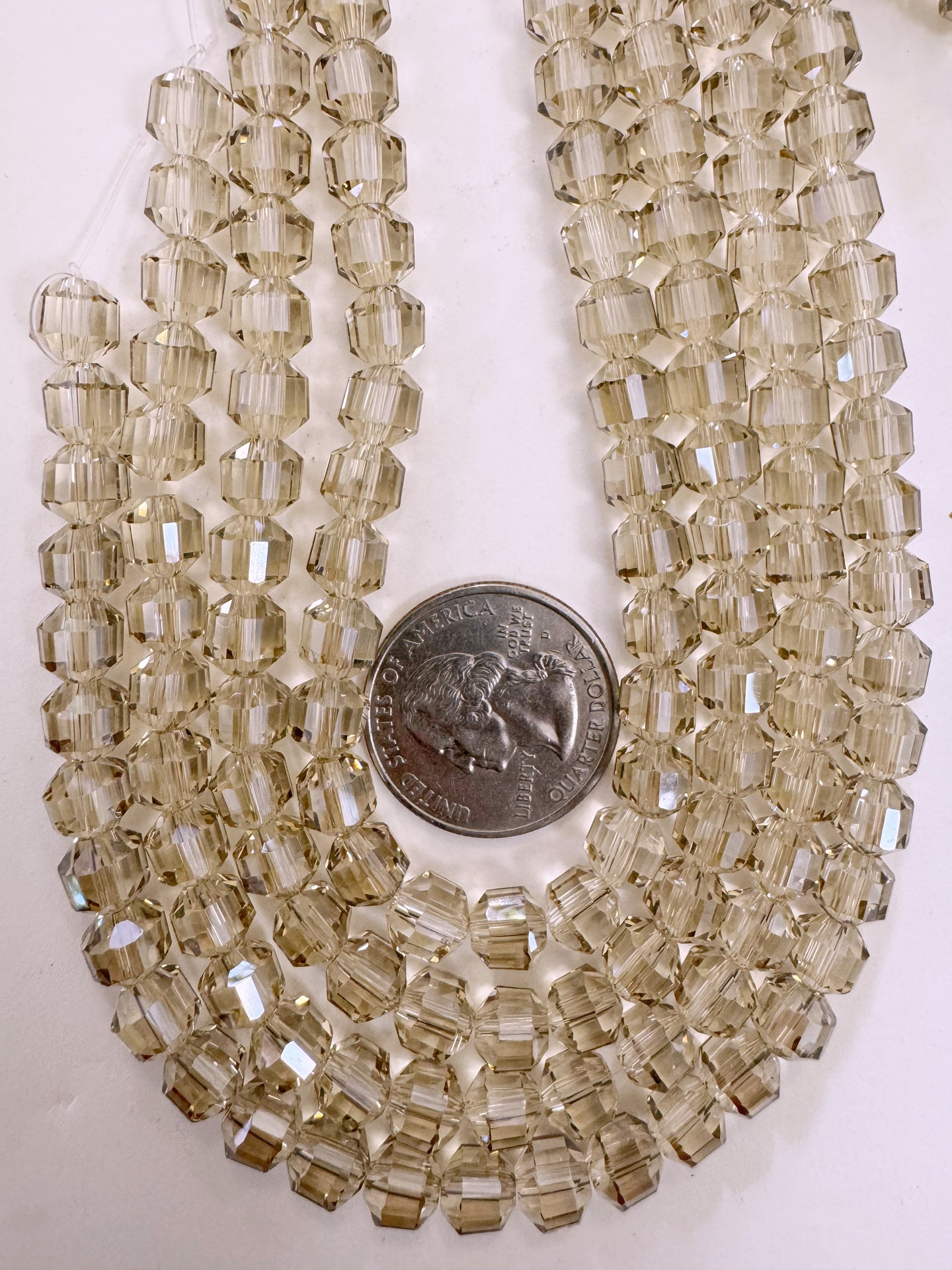 white flash coated pale dark topaz brown, fancy cut, vintage look glass, 7mm faceted bicone barrel, 9.5