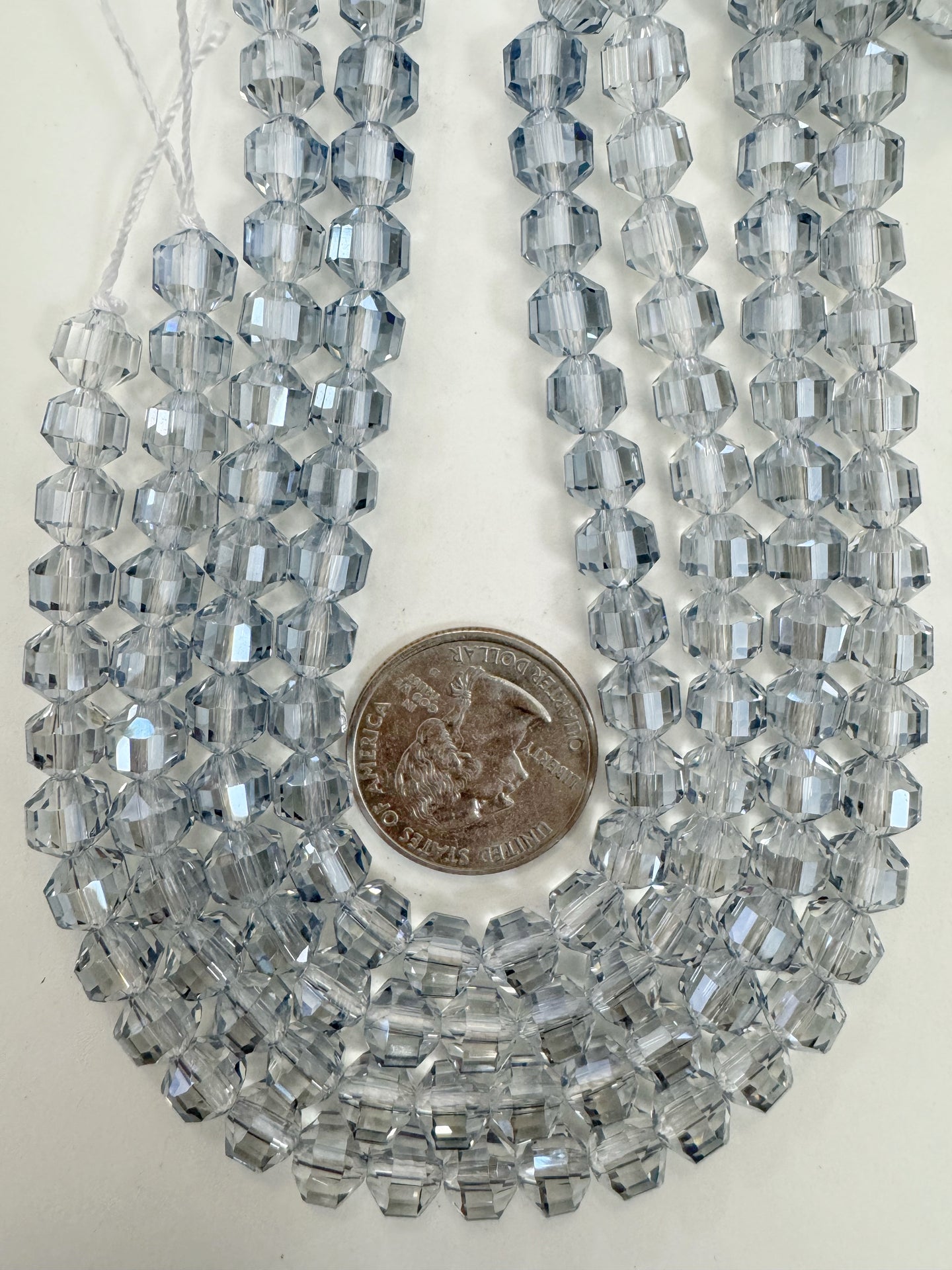 white flash coated dark pale blue, fancy cut, vintage look glass, 7mm faceted bicone barrel, 9.5