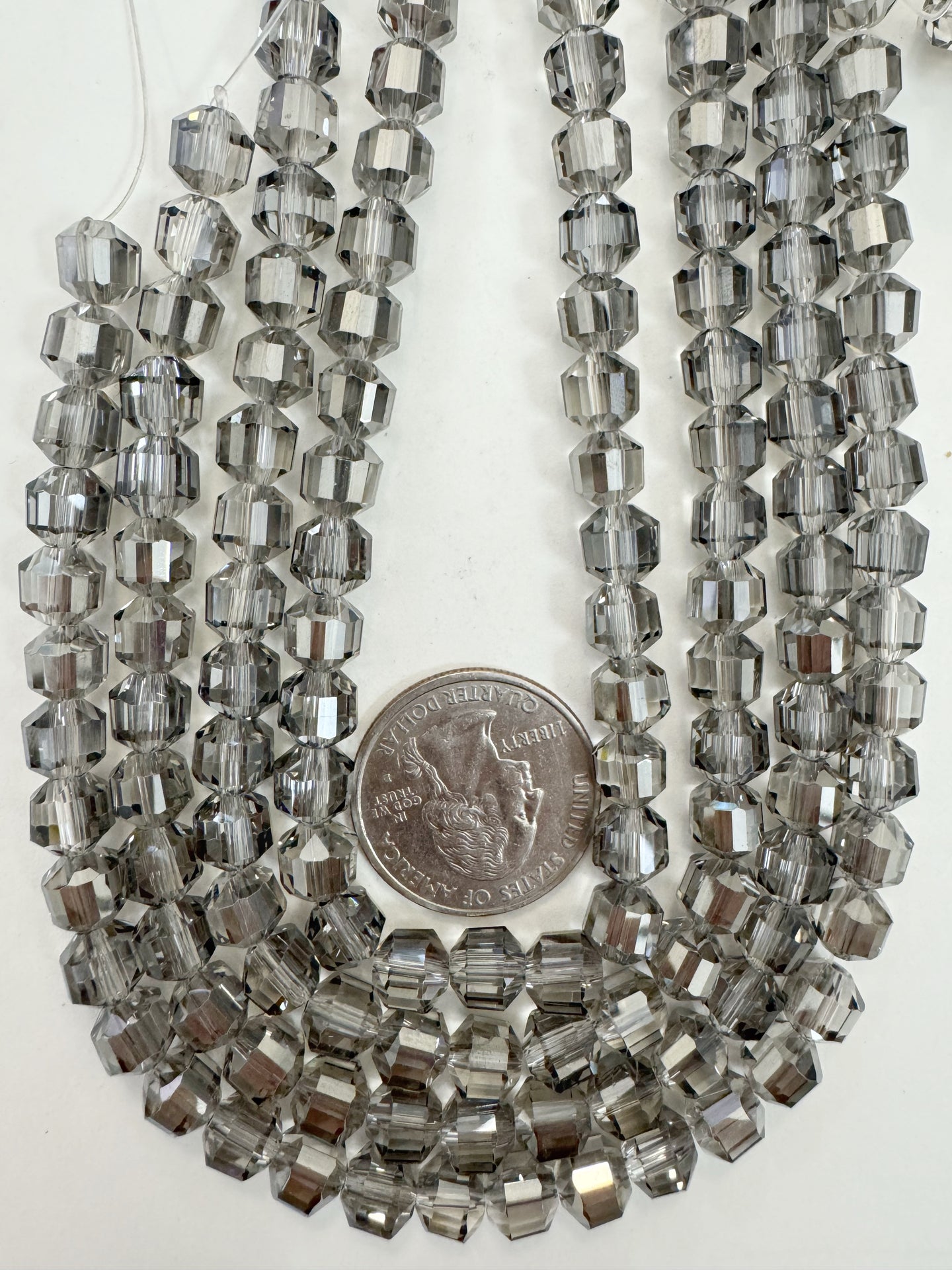 gray flash coated clear, fancy cut, vintage look glass, 7mm faceted bicone barrel, 9.5