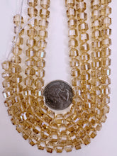 white flash coated dark peach, fancy cut, vintage look glass, 7mm faceted bicone barrel, 9.5" strand, sold per strand
