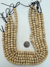 off white brown, carved crossing lines eye motif, vintage stock bone, 10x8mm rondelle, 15" strand, SOLD PER STRAND