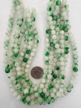 color enhanced quartz: green off white, 8mm round, 15" strand,  SOLD PER STRAND