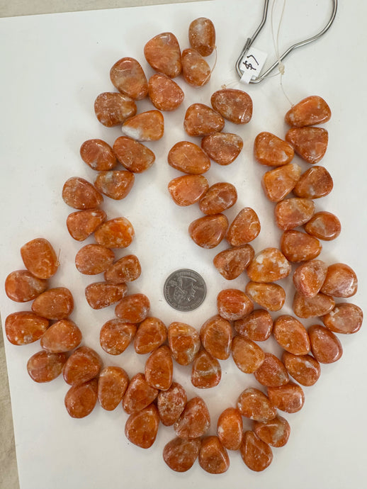 orange calcite, 23x16x10mm mixed nugget pendant, 15