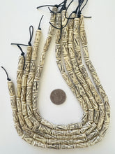 off white brown black, carved line eye motif, vintage stock bone, 21x7mm tube, 15" strand, SOLD PER STRAND