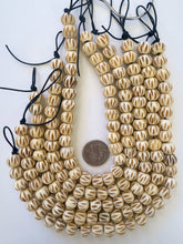 off white brown, carved line motif, vintage stock bone, 13x11mm rondelle, 11.5" strand, SOLD PER STRAND