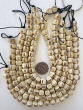 off white brown, carved line motif, vintage stock bone, 11x9mm 3 sided rondelle, 11.5" strand, SOLD PER  STRAND