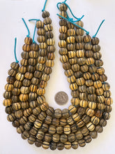 brown black, carved melon cut motif, vintage stock horn, 15x12mm rondelle, 15" strand, SOLD PER STRAND