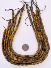 brown black, carved dot motif, vintage stock horn, 16x7mm tube, 15" strand, SOLD PER STRAND