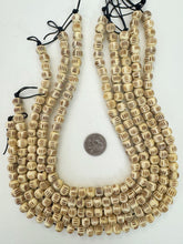 off white black, carved parallel lines motif, vintage stock bone, 11x8mm rondelle, 15" strand, SOLD PER STRAND