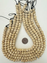 off white browm, carved spiral lines motif, vintage stock bone, 11x8mm rondelle, 15" strand, SOLD PER STRAND