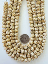 off white brown, carved crossing lines eye motif, vintage stock bone, 10x8mm rondelle, 15" strand, SOLD PER STRAND