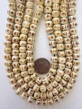 off white, carved sarburst lines motif, vintage stock bone, 10x8mm rondelle, 15" strand,  SOLD PER STRAND