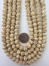 off white brown, carved up lines motif, vintage stock bone, 10x8mm rondelle, 15" strand,  SOLD PER STRAND