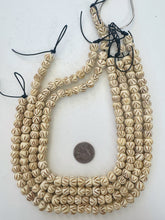 off white brown, carved up lines motif, vintage stock bone, 10x8mm rondelle, 15" strand,  SOLD PER STRAND
