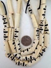 off white black, carved dark lines x motif, vintage stock bone, 27x11x7mm flattened tube, 15" strand, SOLD PER STRAND