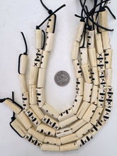 off white black, carved dark lines x motif, vintage stock bone, 27x11x7mm flattened tube, 15" strand, SOLD PER STRAND