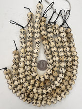off white, carved x motif, vintage stock bone, 14x11mm rondelle, 12" strand,  SOLD PER STRAND