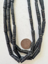dark brown, carved lines motif, vintage stock bone, 25x6mm pointed tube, 15" strand, SOLD PER STRAND