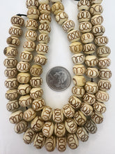 off white brown, carved circles motifs, vintage stock bone, 12x9mm rondelle, 11" strand, SOLD PER STRAND