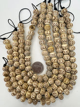 off white brown, carved circles motifs, vintage stock bone, 12x9mm rondelle, 11" strand, SOLD PER STRAND