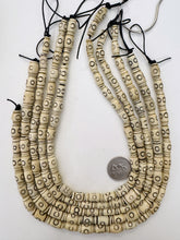 off white brown black, carved circle line motif, vintage stock bone, 13x8mm barrel, 15" strand, SOLD PER STRAND