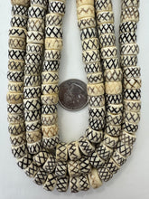 off white brown black, carved x motif, vintage stock bone, 12x7mm rondelle, 15" strand, SOLD PER STRAND