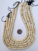 off white, carved dot line motif, vintage stock bone, 21x9mm tube, 15" strand, SOLD PER STRAND