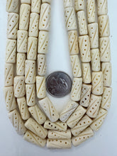 off white, carved dot line motif, vintage stock bone, 21x9mm tube, 15" strand, SOLD PER STRAND