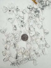 howiite, 18-20mm shape animal and nature motifs, 15" strand, sold per strand, may have some chipped or broken beads