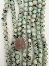 kiwi quartz, 8mm round, 15" strand,  SOLD PER STRAND