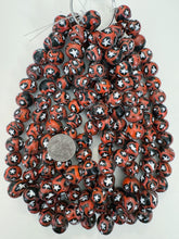 pale red orange black circle star motif, vintage look glass, 15x12mm rondelle mix, 15" strand, sold per strand