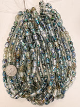 clear blue light metallic silver green red inside lined dotted motif, vintage look glass, 12x9mm bowed tube barrel, 15" strand, sold per strand