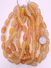 matte clear red white yellow feathered swirl, vintage look glass, 27x14mm bowed tube, 15" strand, sold per strand
