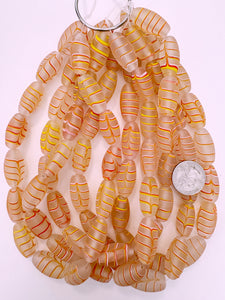 matte clear red white yellow feathered swirl, vintage look glass, 27x14mm bowed tube, 15" strand, sold per strand