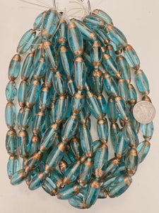aqua blue metallic copper swirl, vintage look glass, 24-31mm bowed tube mix, 15" strand, sold per strand